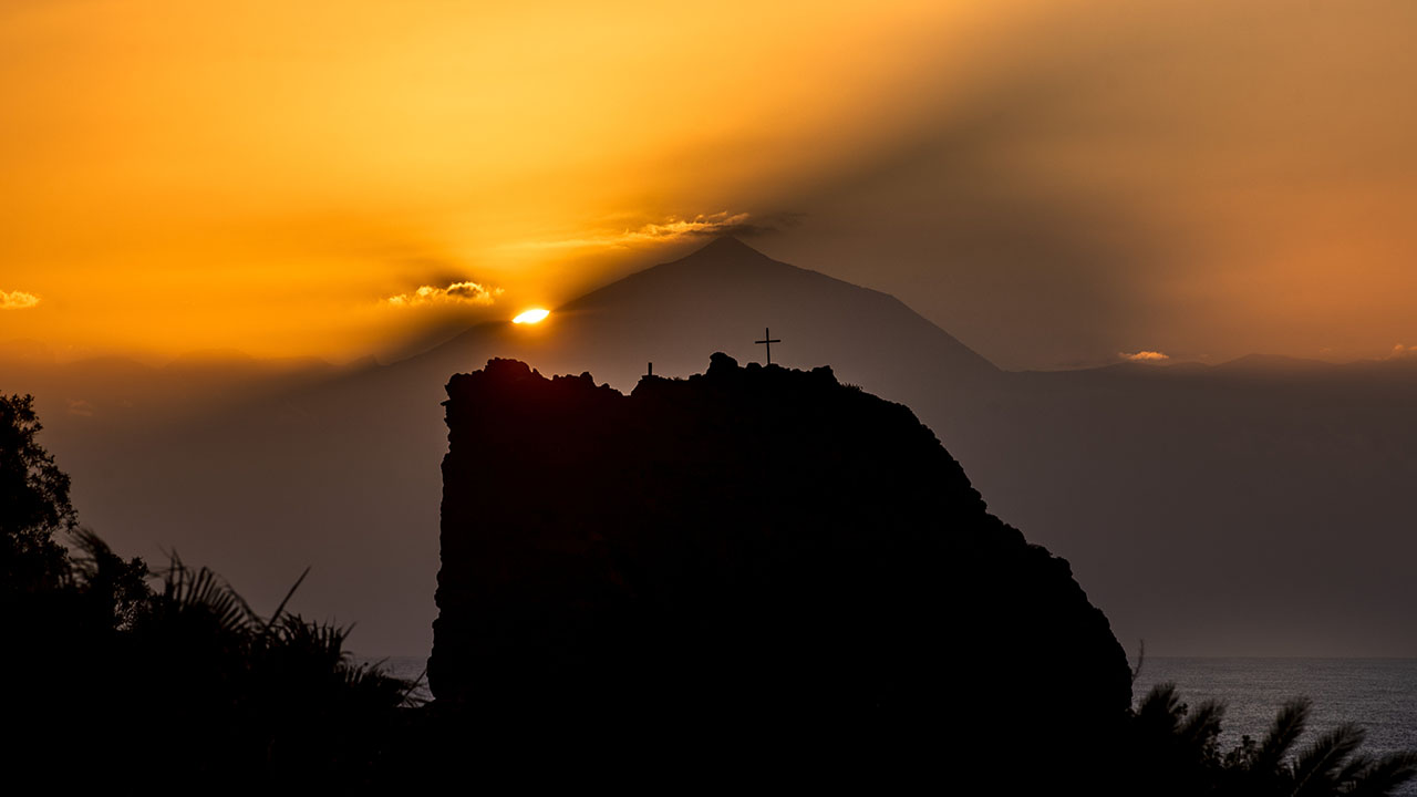 Sunset in Agaete, Gran Canaria. Teide on the island of Tenerife, in the background of the image